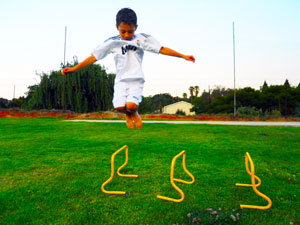 athlete-jumping-over-speed-hurdles